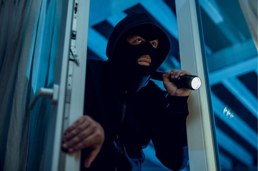 burglar entering house